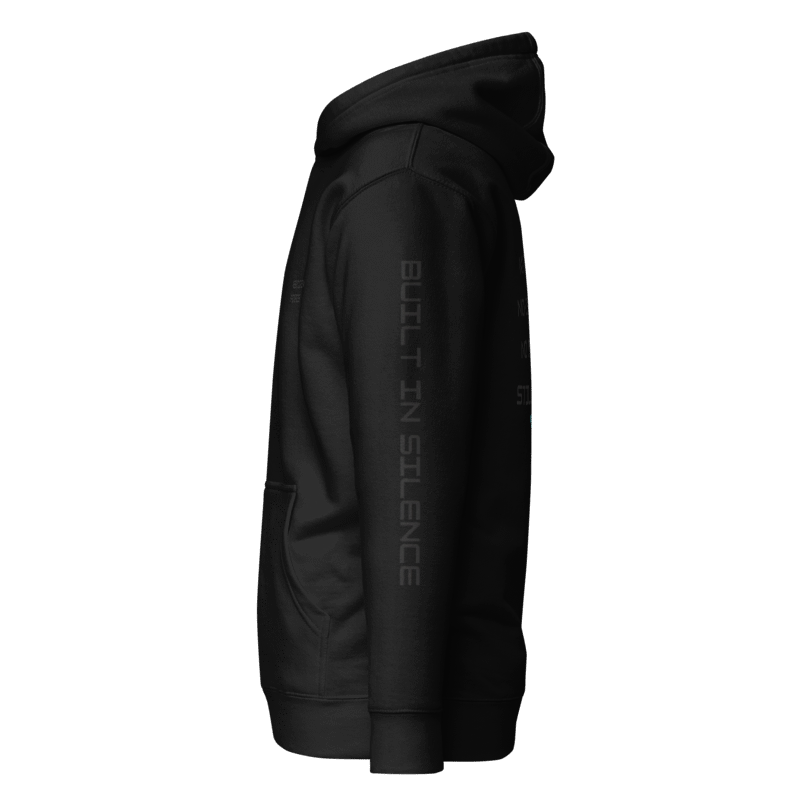 Black hoodie with 'Built in Silence' text on left sleeve