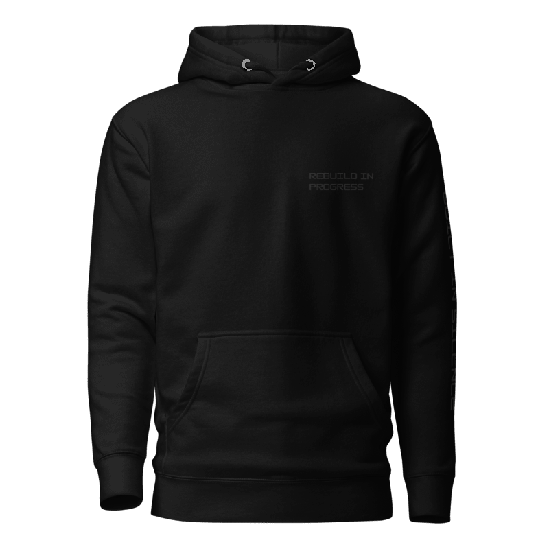 Black hoodie with text REBUILD IN PROGRESS on the left chest 