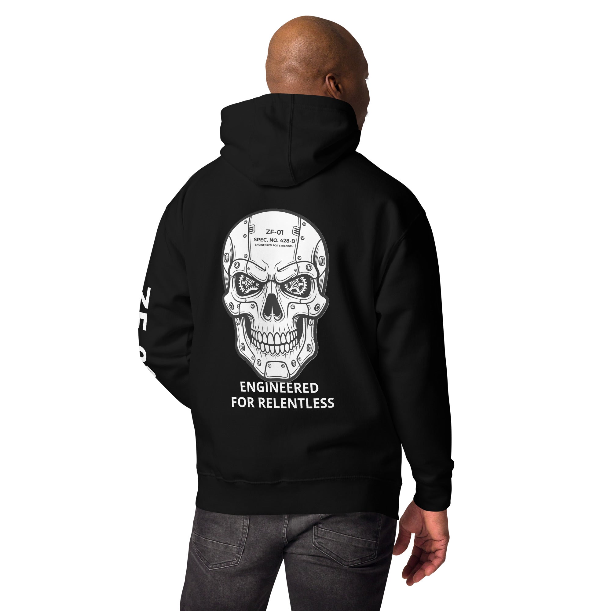 Man wearing a black hoodie with a fabricated skull design and  "ENGINEERED FOR RELENTLESS" text on the back