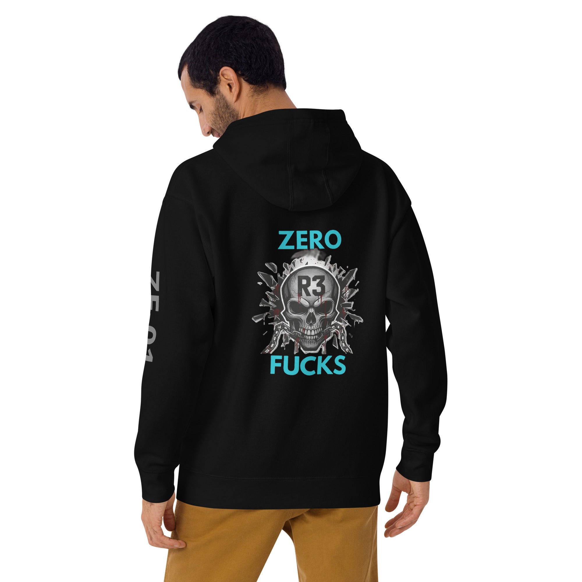 Man wearing a black hoodie with a graphic skull design on the back and teal text