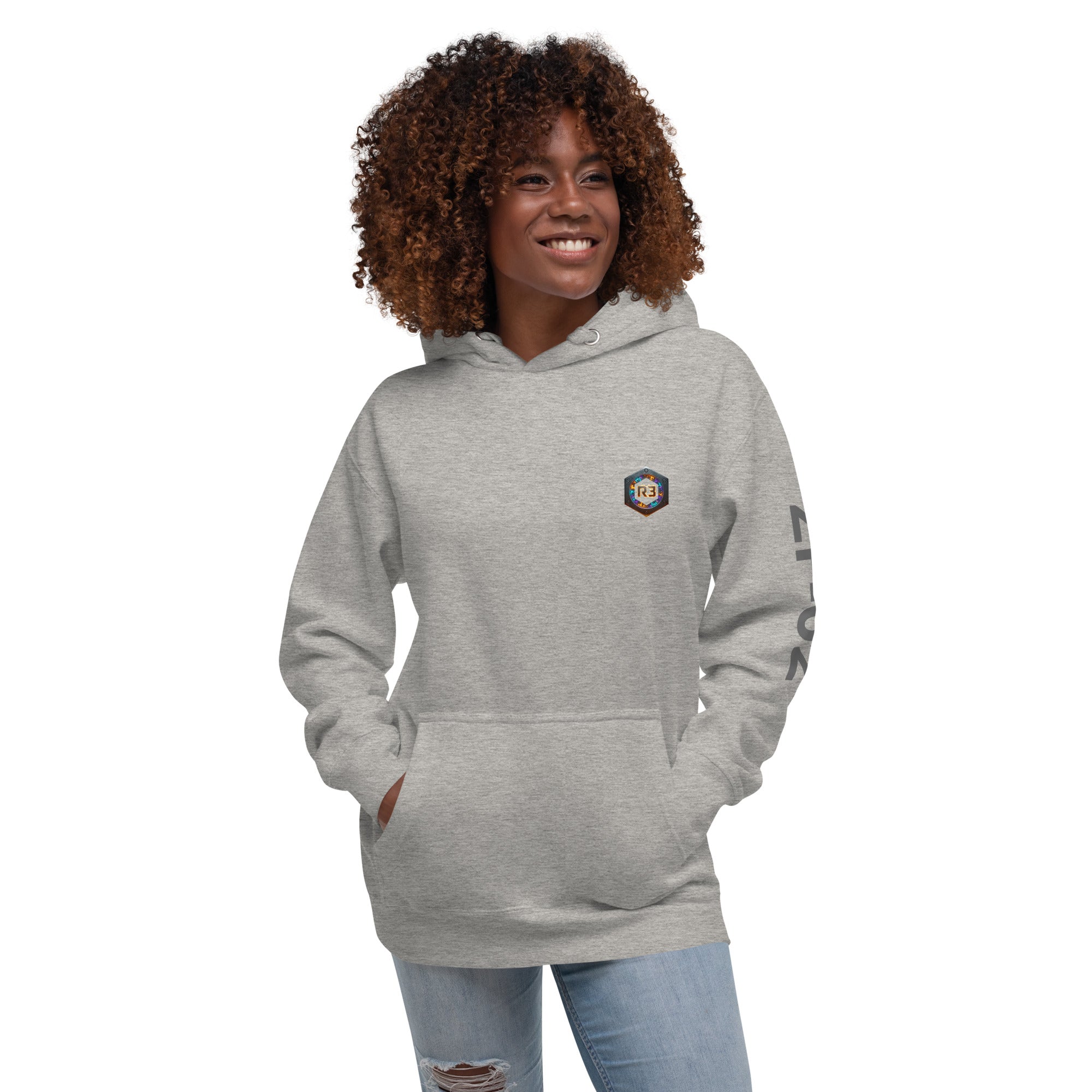 Woman wearing a gray hoodie with a R3 logo