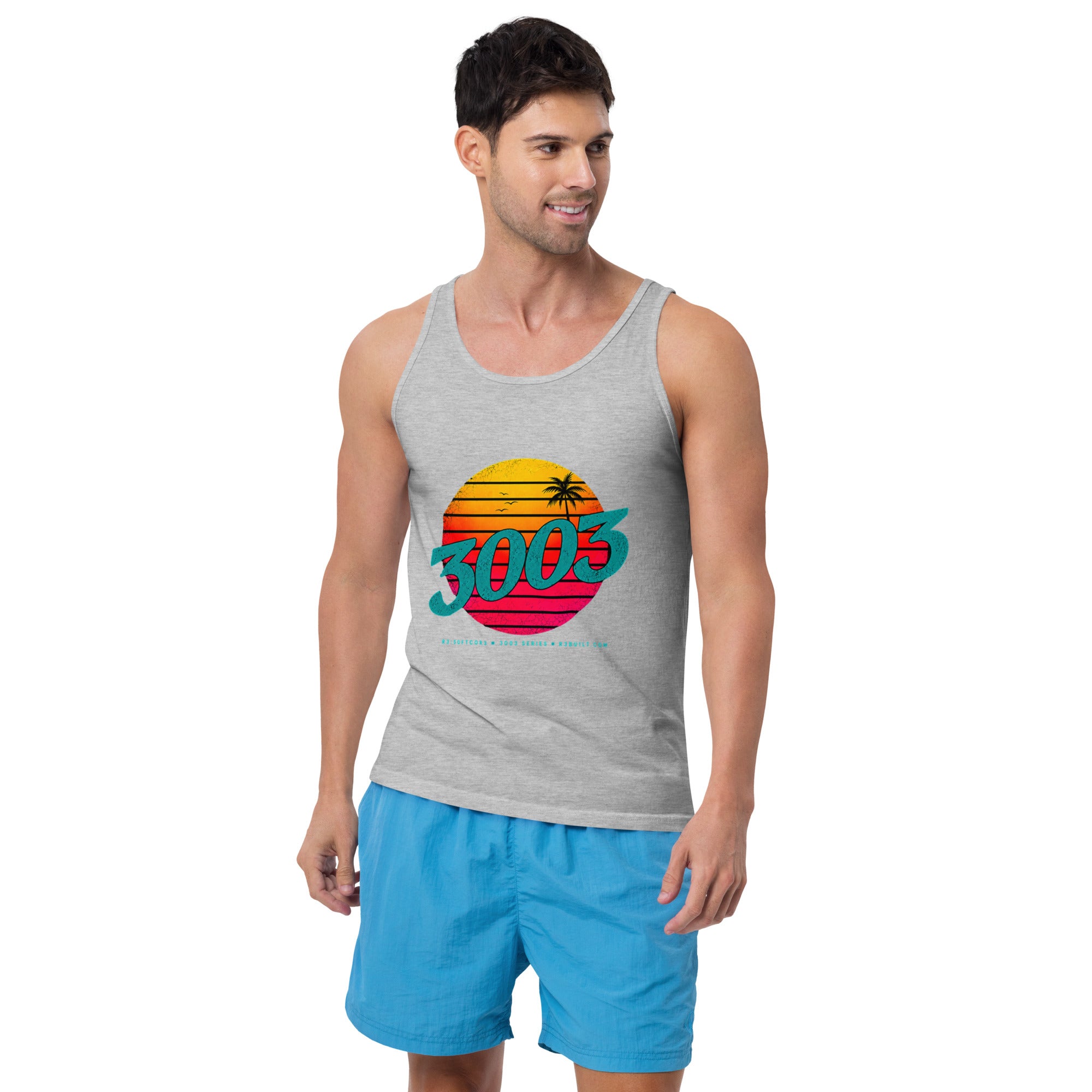 A man wearing a heather gray tank top with a colorful retro-style sunset graphic and the text '3003' across the chest, paired with bright blue shorts.