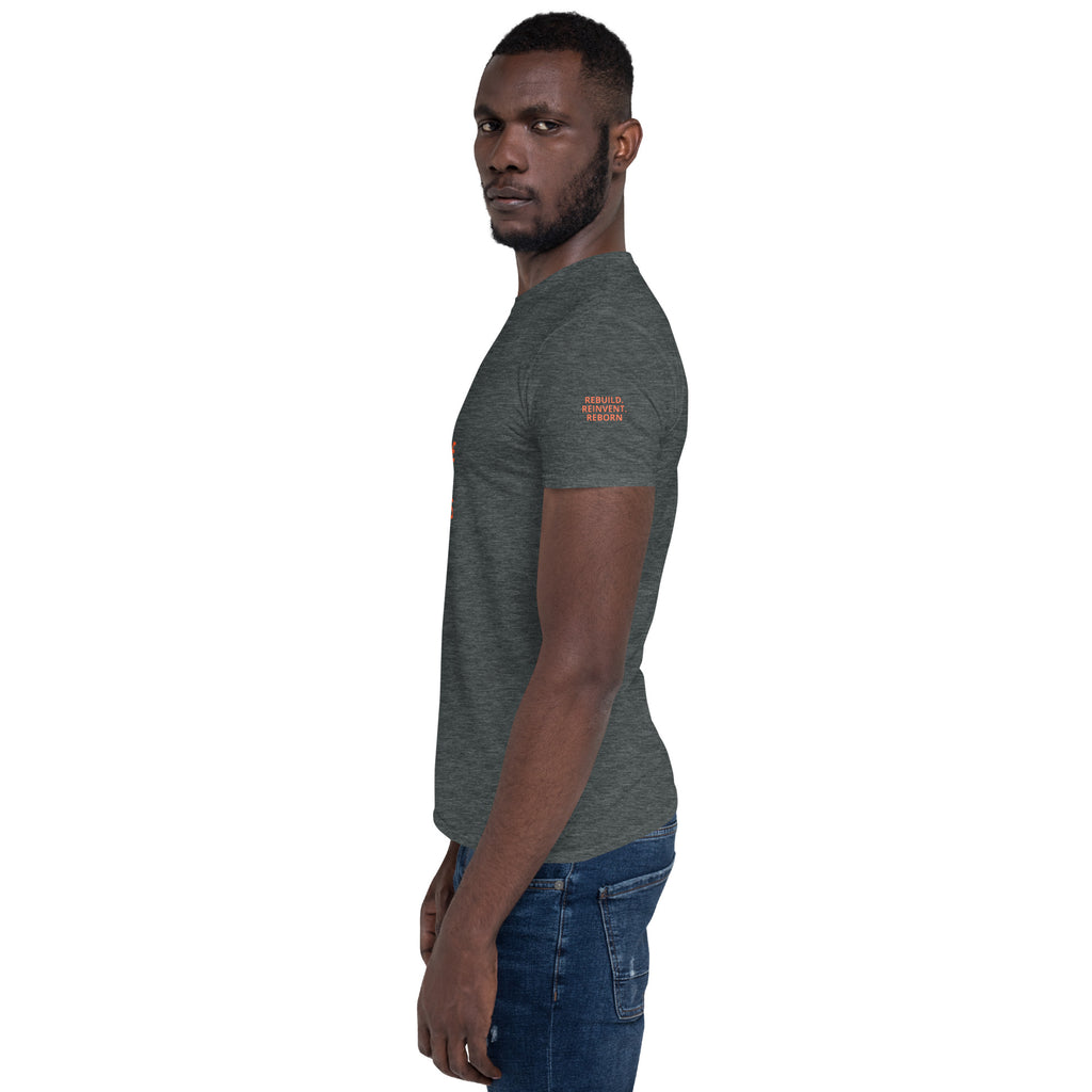 PRESSURE WAS THE PROCESS Dark Heather t-shirt sleeve: REBUILD. REINVENT. REBORN. stacked text.
