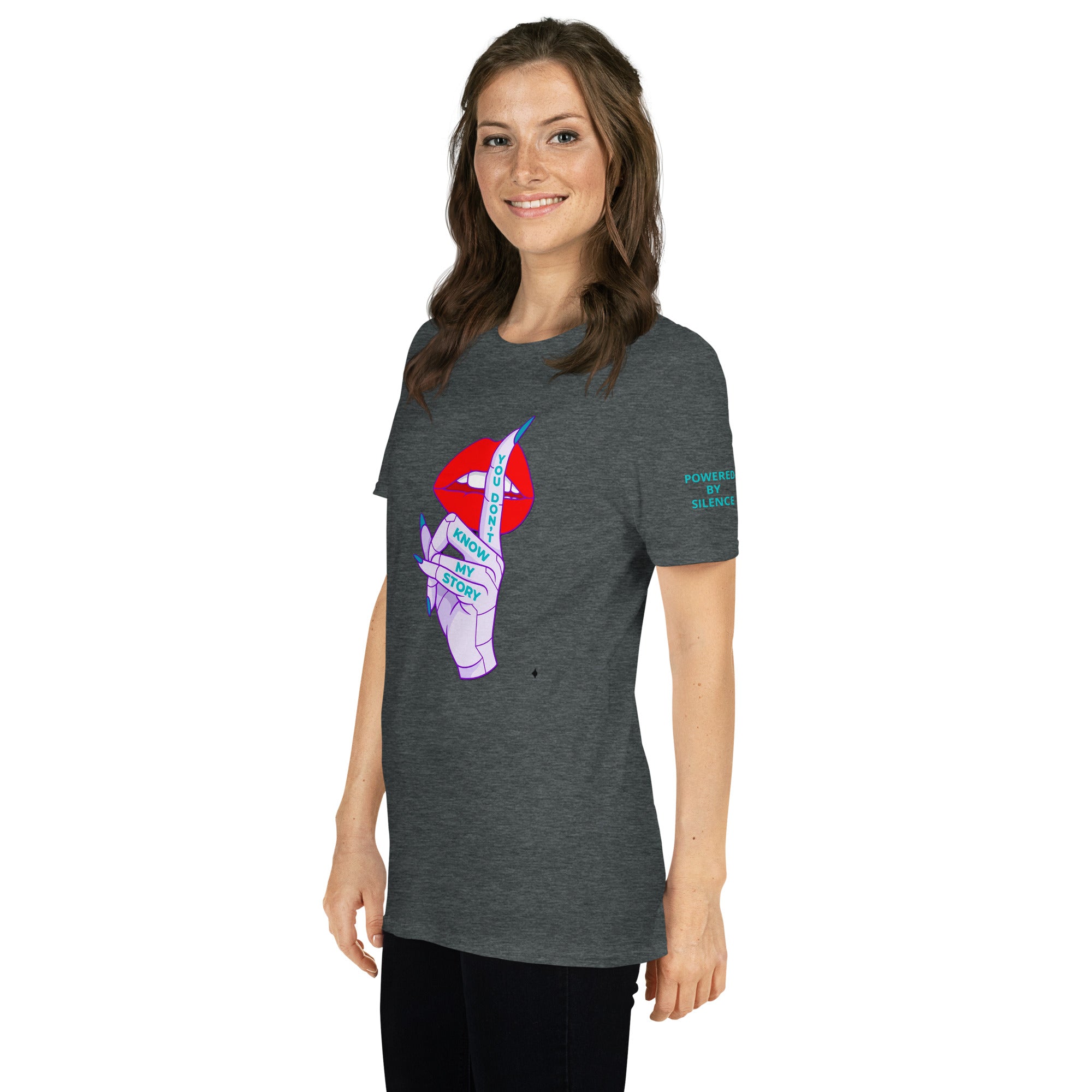 Woman wearing a gray t-shirt with a colorful graphic design with text You Don't Know My story of the front and Powered By Silence on left sleeve