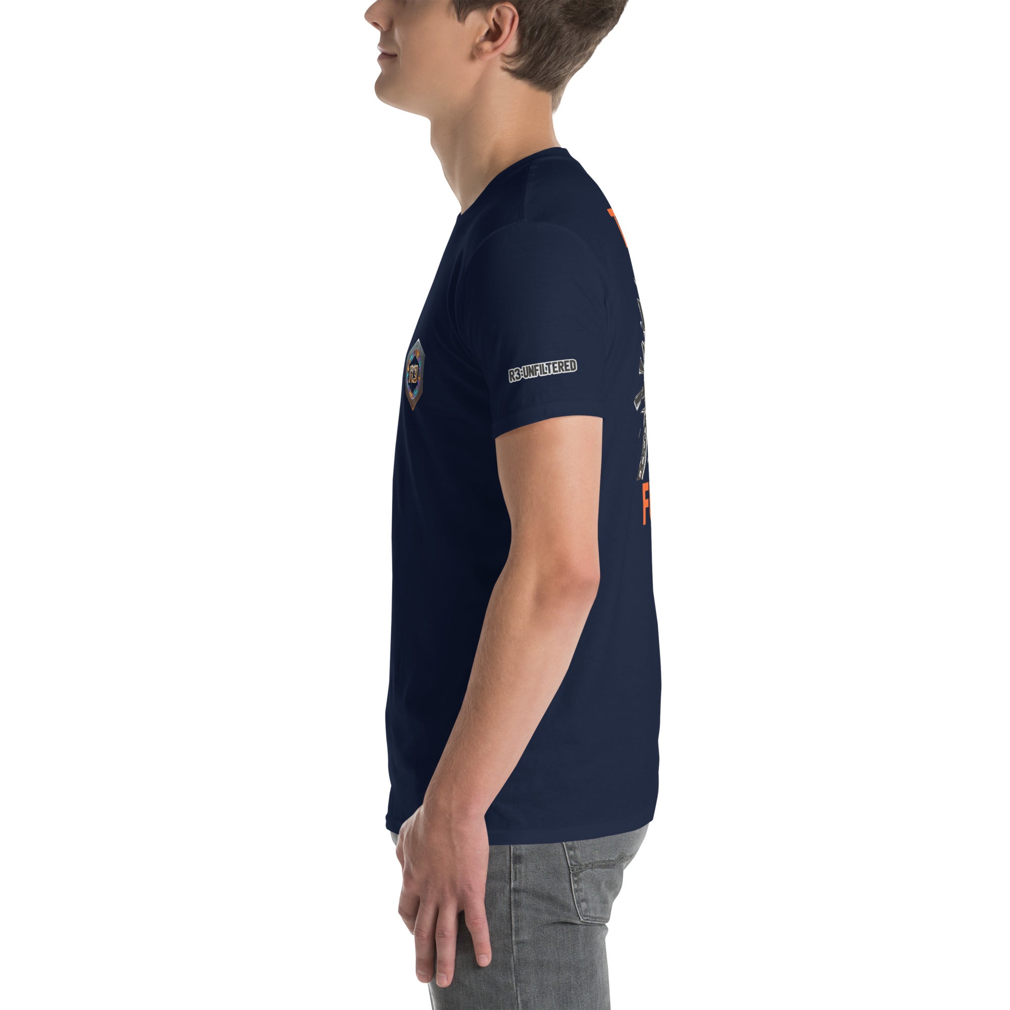 Person wearing a navy blue t-shirt with patches on a white background