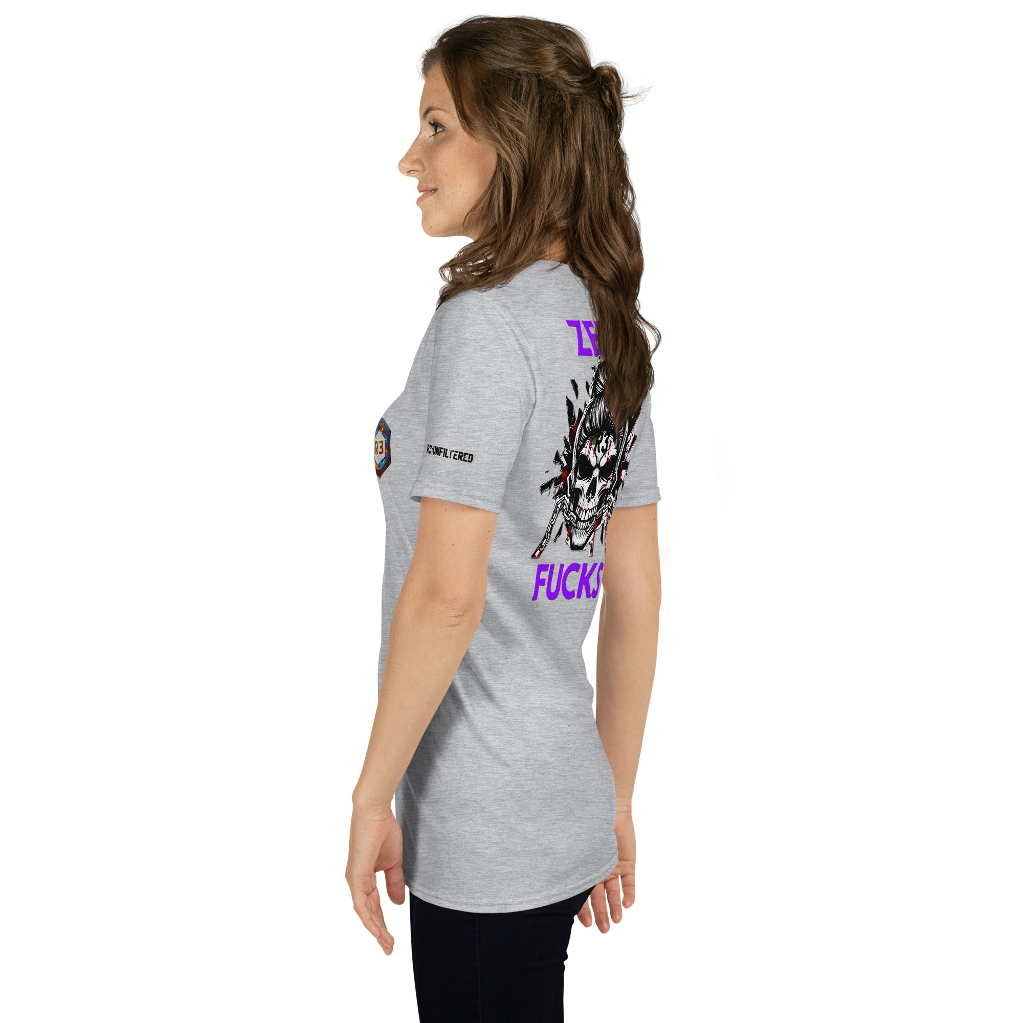 Woman wearing a gray t-shirt with graphic designs and text 