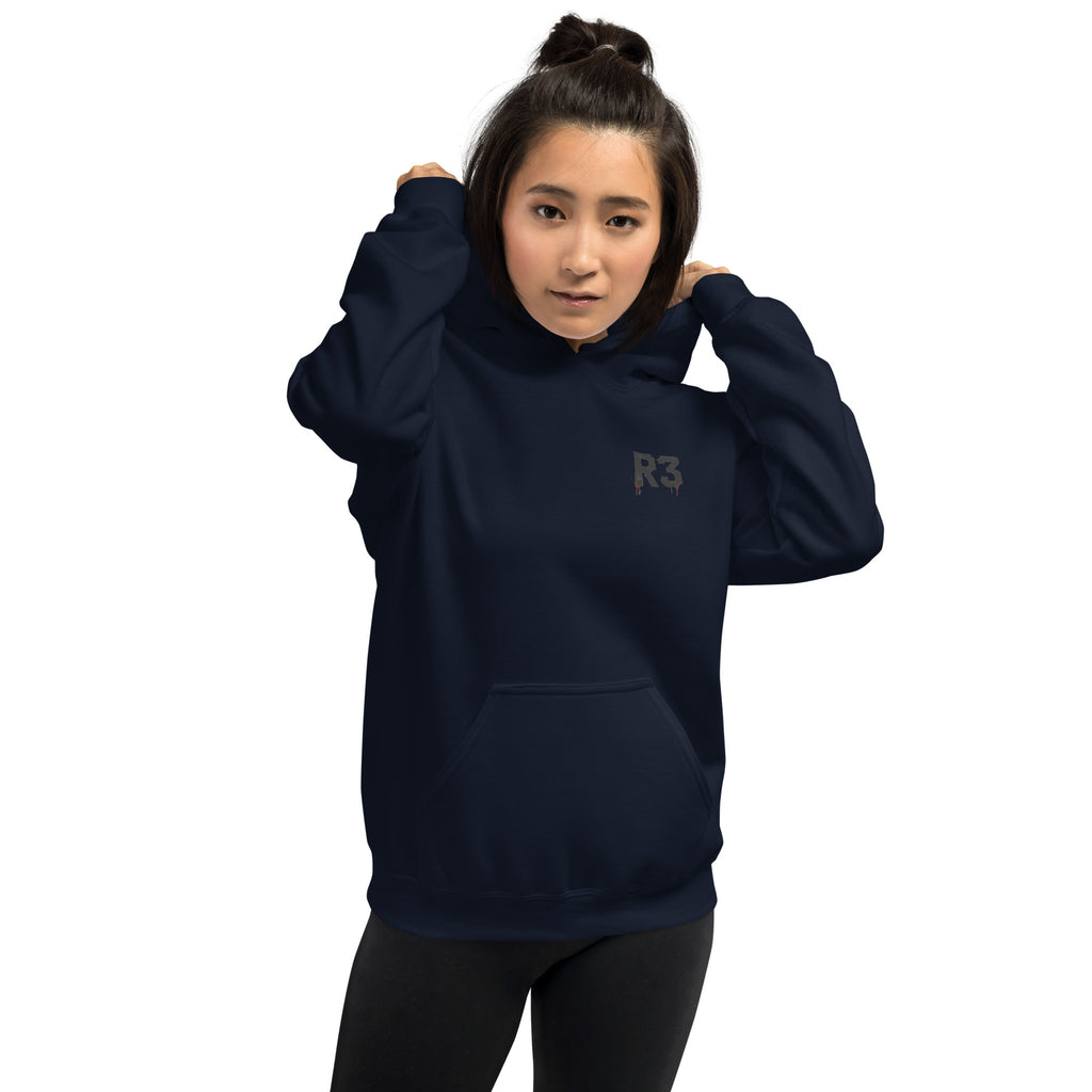 Woman wearing a navy blue hoodie with R3 logo on front left chest.