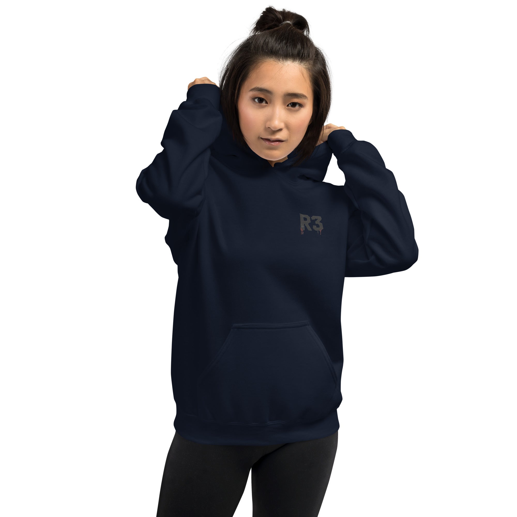 Woman wearing a navy blue hoodie with R3 logo on front left chest.