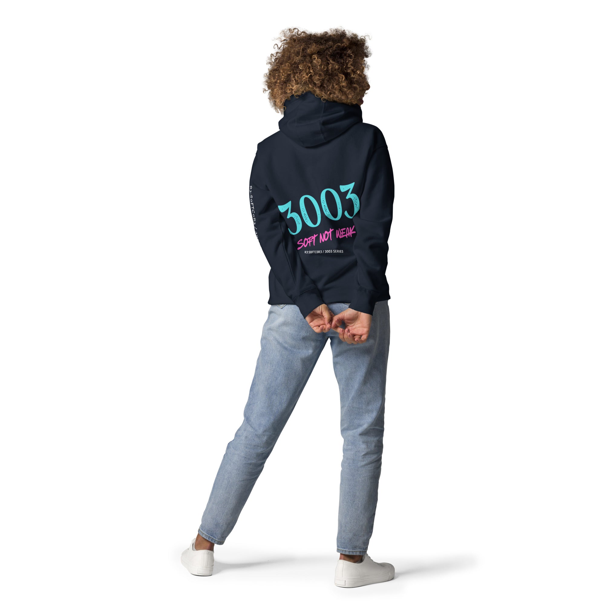 Woman wearing a navy hoodie with 3003  SOFT NOT WEAK  on the back, R3:S0FTC0R3 / 3003 Series | R3:BU1LT
